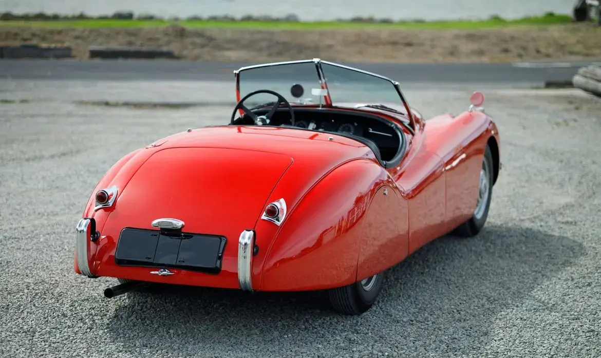 Red 1951 Jaguar XK120 Roadster for sale at Fantasy Junction in Emeryville, California
