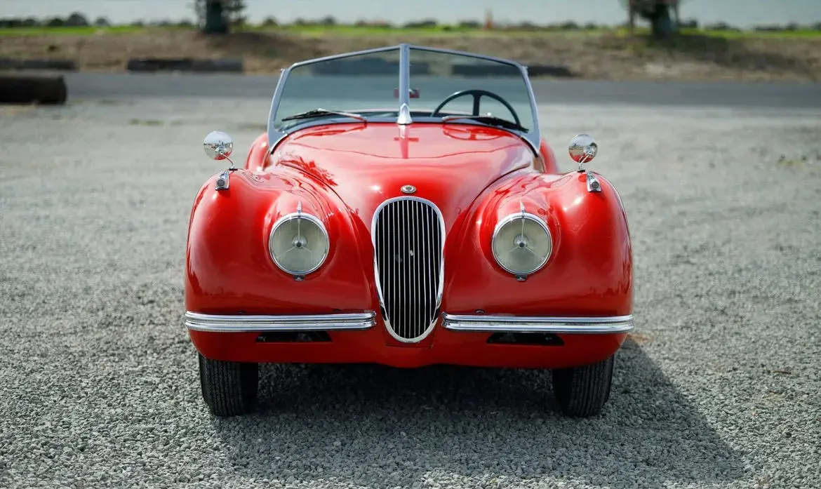 Red 1951 Jaguar XK120 Roadster for sale at Fantasy Junction in Emeryville, California